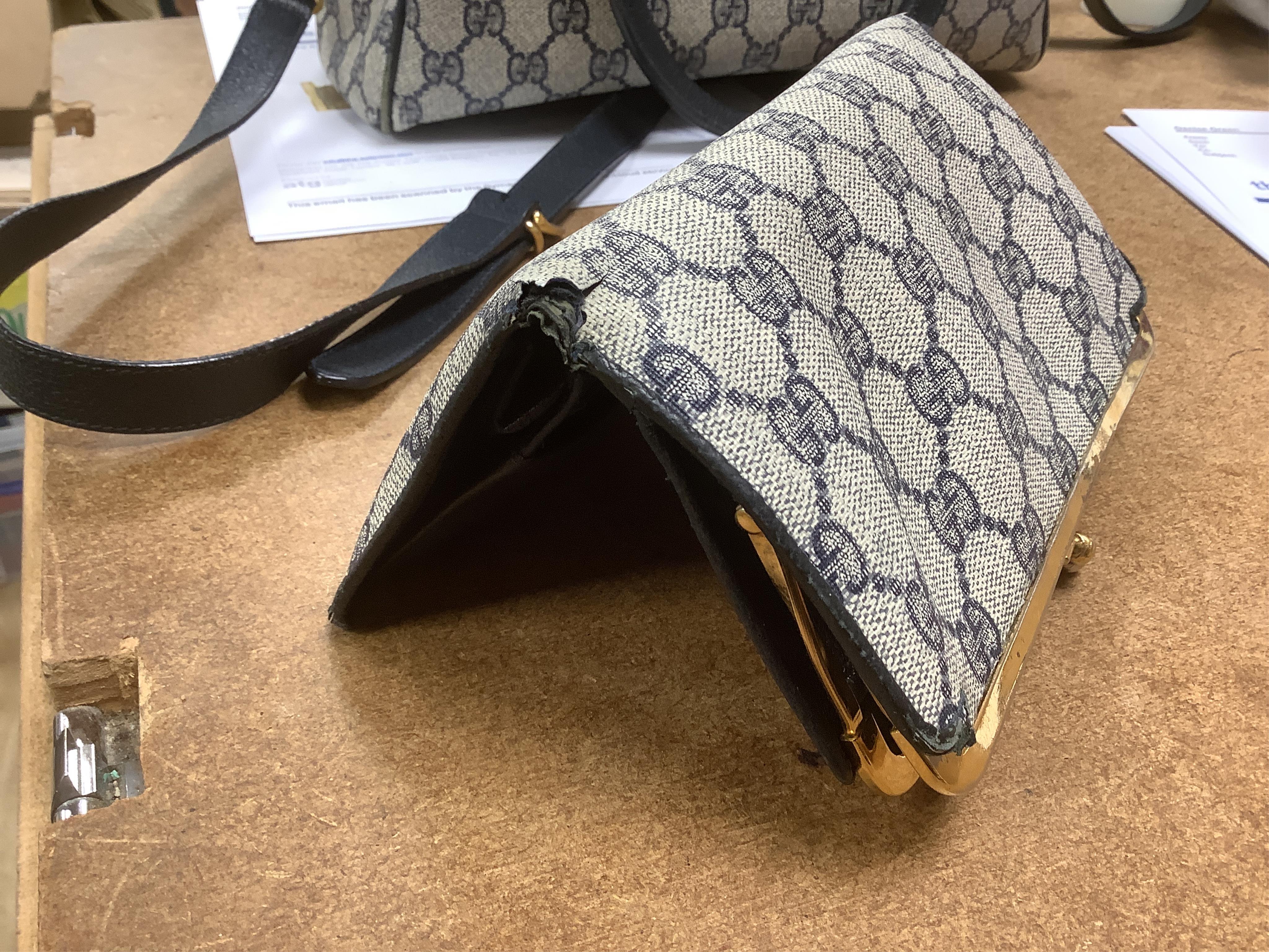 A Gucci monogram blue canvas handbag, wallet and purse